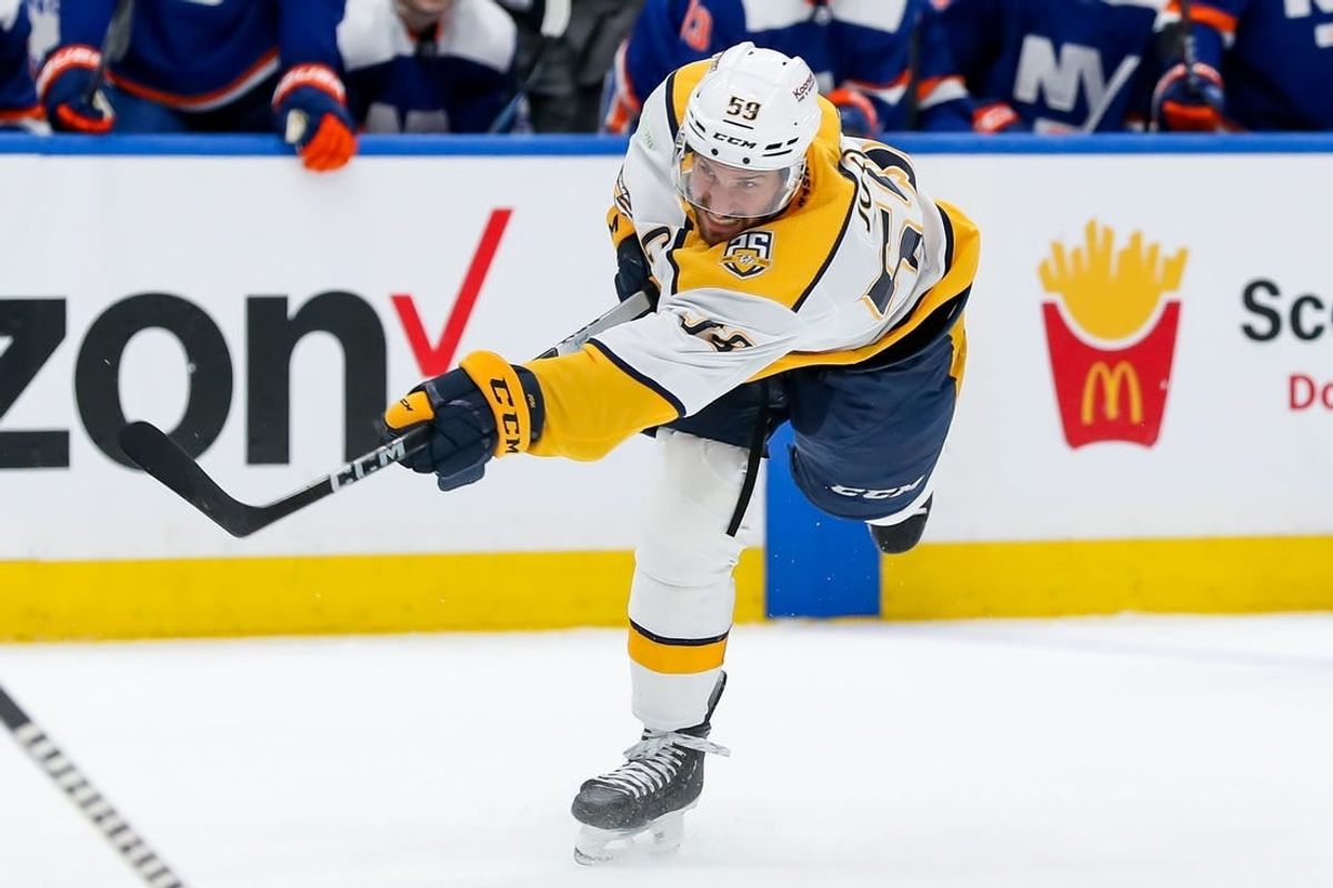 Apr 6, 2024; Elmont, New York, USA; Nashville Predators defenseman Roman Josi (59) shoots the puck against the New York Islanders during the third period at UBS Arena.