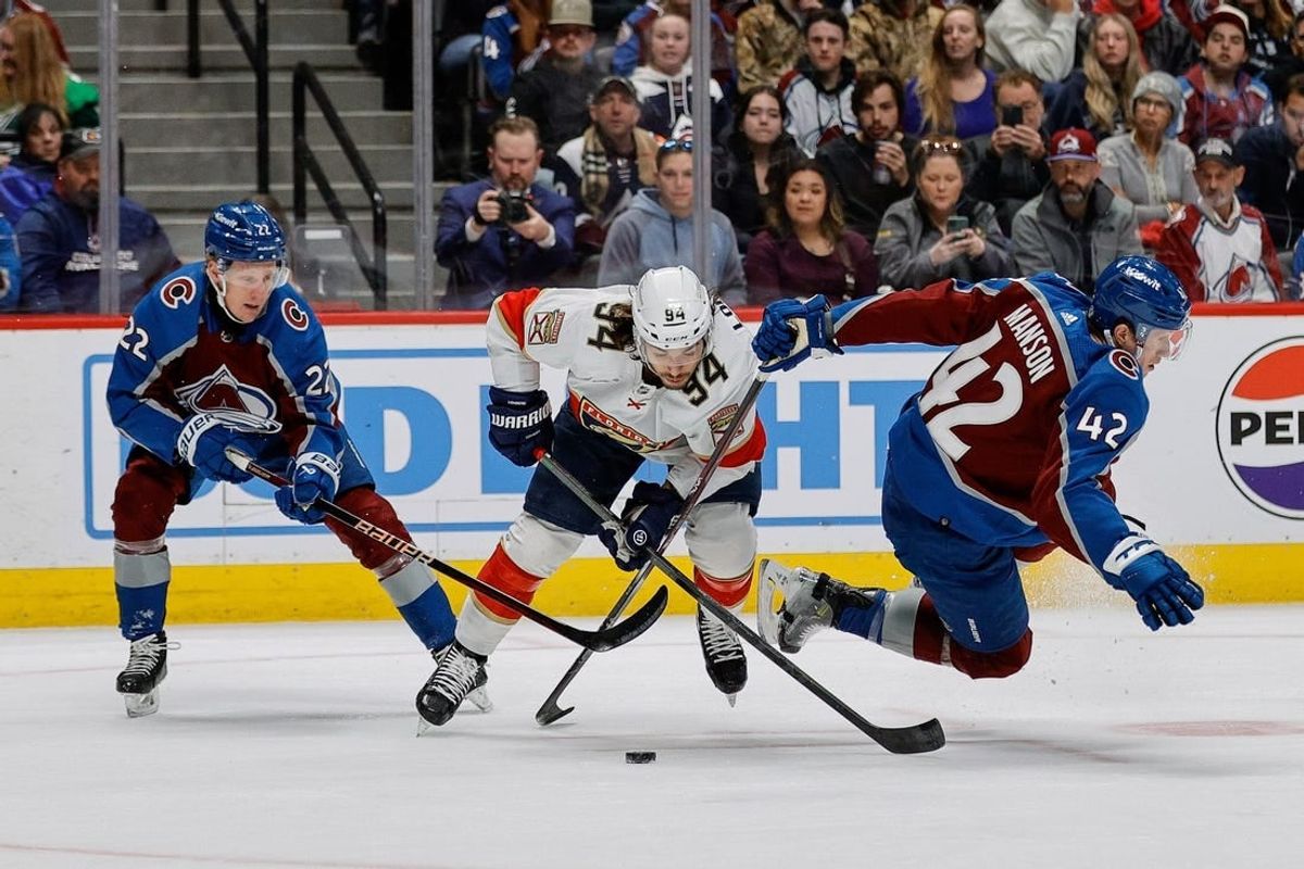 Jan 6, 2024; Denver, Colorado, USA; Florida Panthers left wing Ryan Lomberg (94) gets tied up with Colorado Avalanche left wing Fredrik Olofsson (22) and defenseman Josh Manson (42) in the first period at Ball Arena.