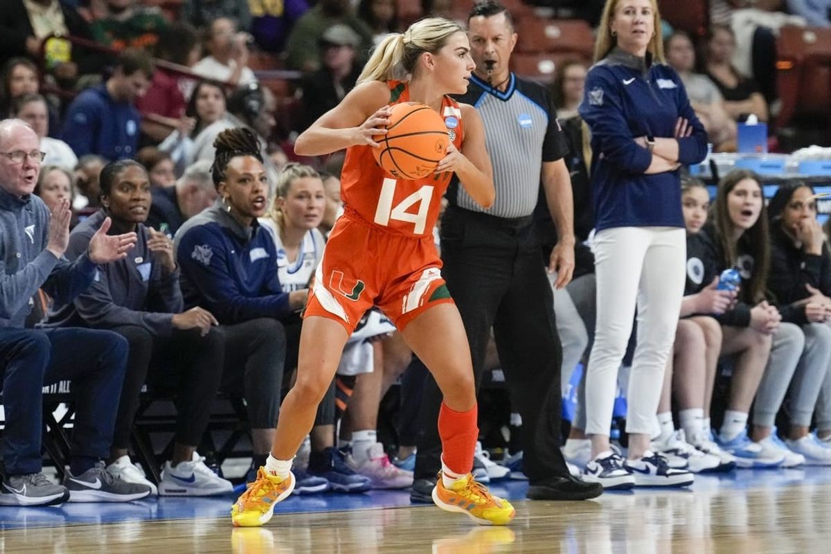 Mar 24, 2023; Greenville, SC, USA; Miami Hurricanes guard Haley Cavinder (14) looks for an open teammate against the Villanova Wildcats during the NCAA Women   s Tournament at Bon Secours Wellness Arena.