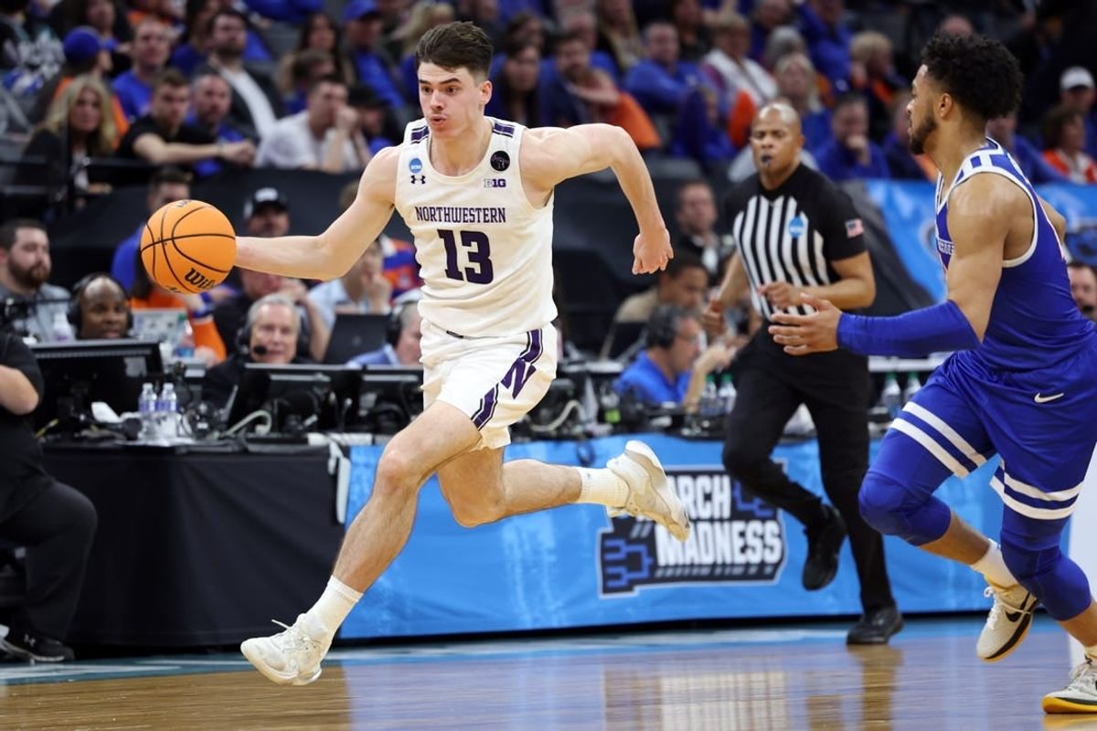 Mar 16, 2023; Sacramento, CA, USA; Northwestern Wildcats guard Brooks Barnhizer (13) controls the ball against Boise State Broncos guard Marcus Shaver Jr. (10) in the second half at Golden 1 Center.