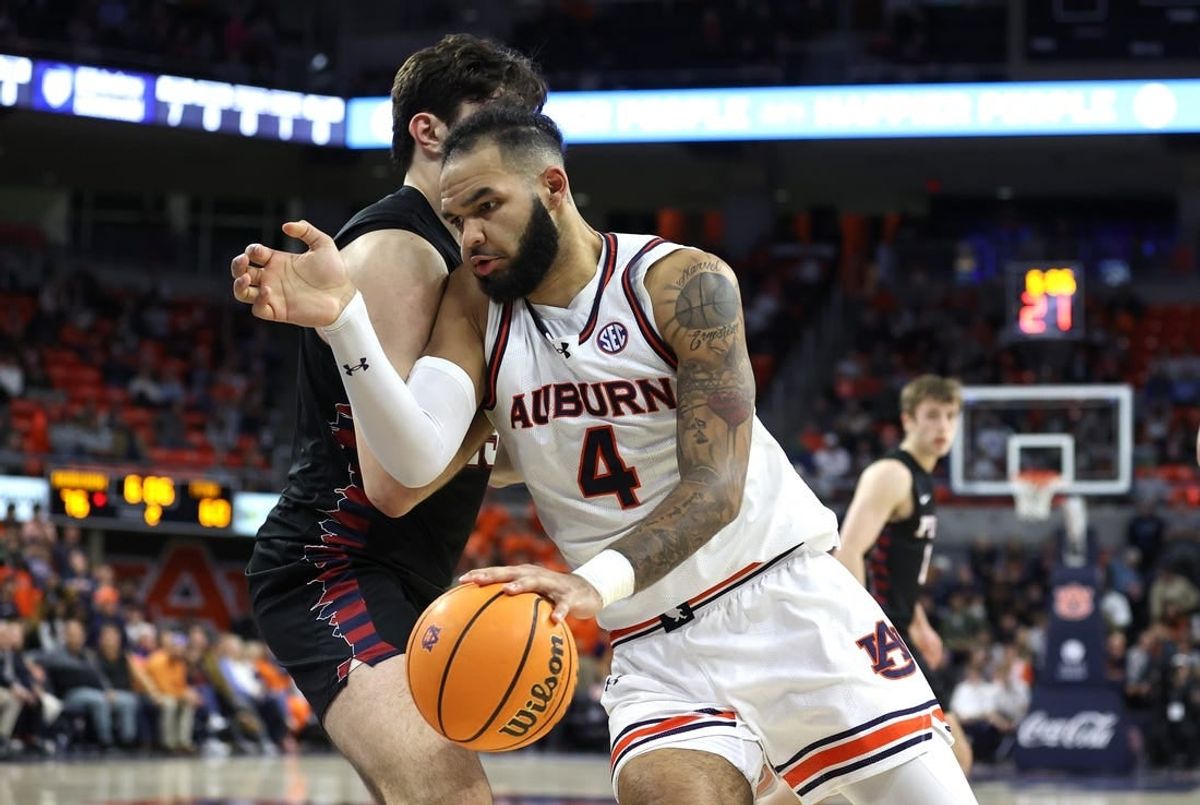 Jan 2, 2024; Auburn, Alabama, USA;  Auburn Tigers forward Johni Broome (4) is the focus of Arkansas' defense this weekend.