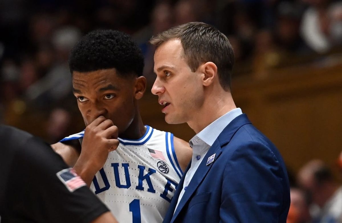 Jan 27, 2024; Durham, North Carolina, USA;Duke Blue Devils head coach Jon Scheyer (right) talks to guard Caleb Foster (1)  during the second half against the Clemson Tigers at Cameron Indoor Stadium.