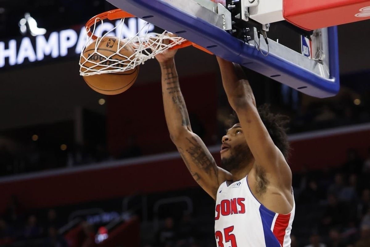 Dec 21, 2023; Detroit, Michigan, USA;  Detroit Pistons forward Marvin Bagley III (35) dunks in the first half against the Utah Jazz at Little Caesars Arena.