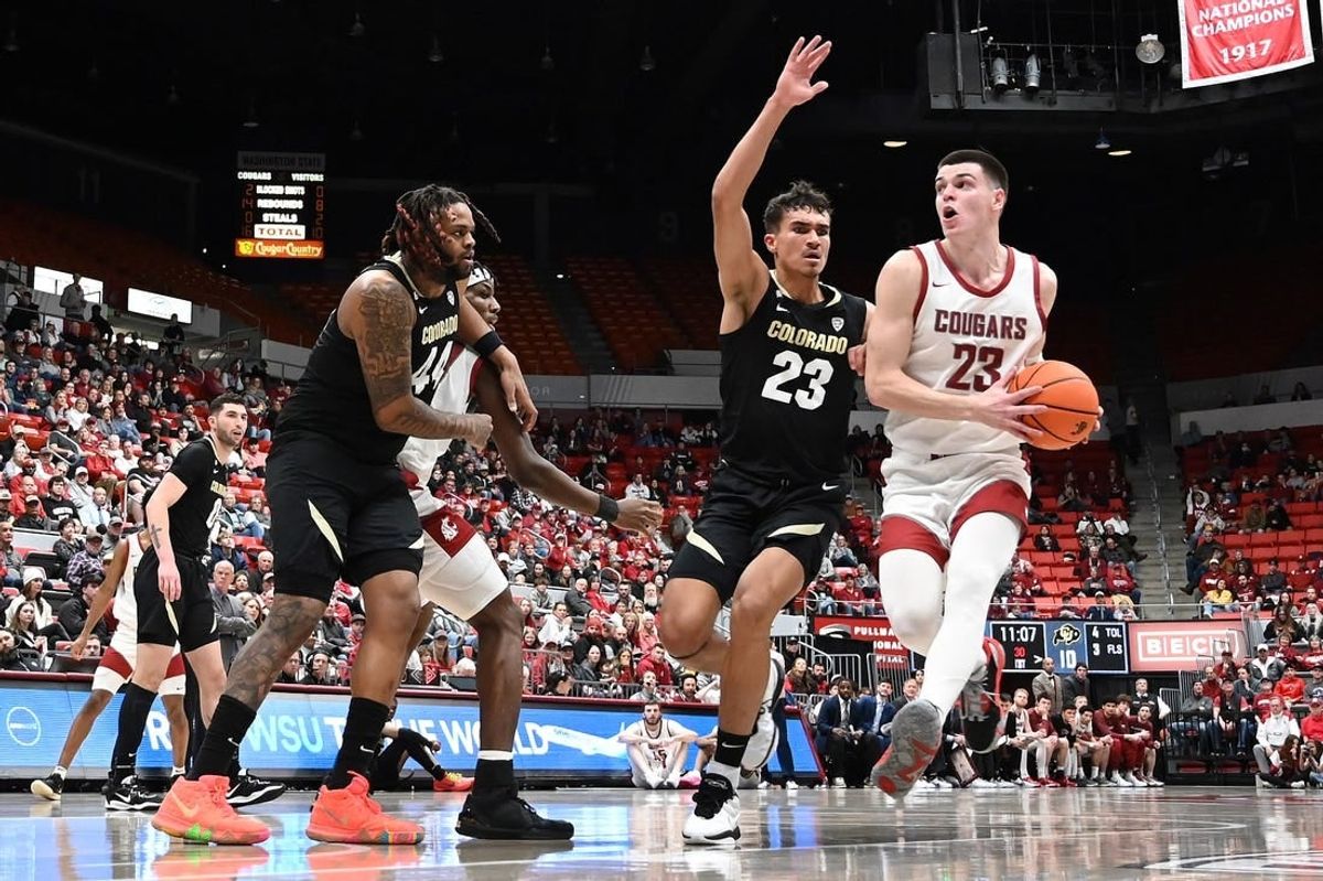 Jan 27, 2024; Pullman, Washington, USA; Washington State Cougars forward Andrej Jakimovski (right) runs the lane against Colorado Buffaloes forward Tristan da Silva (23) in the first half at Friel Court at Beasley Coliseum.