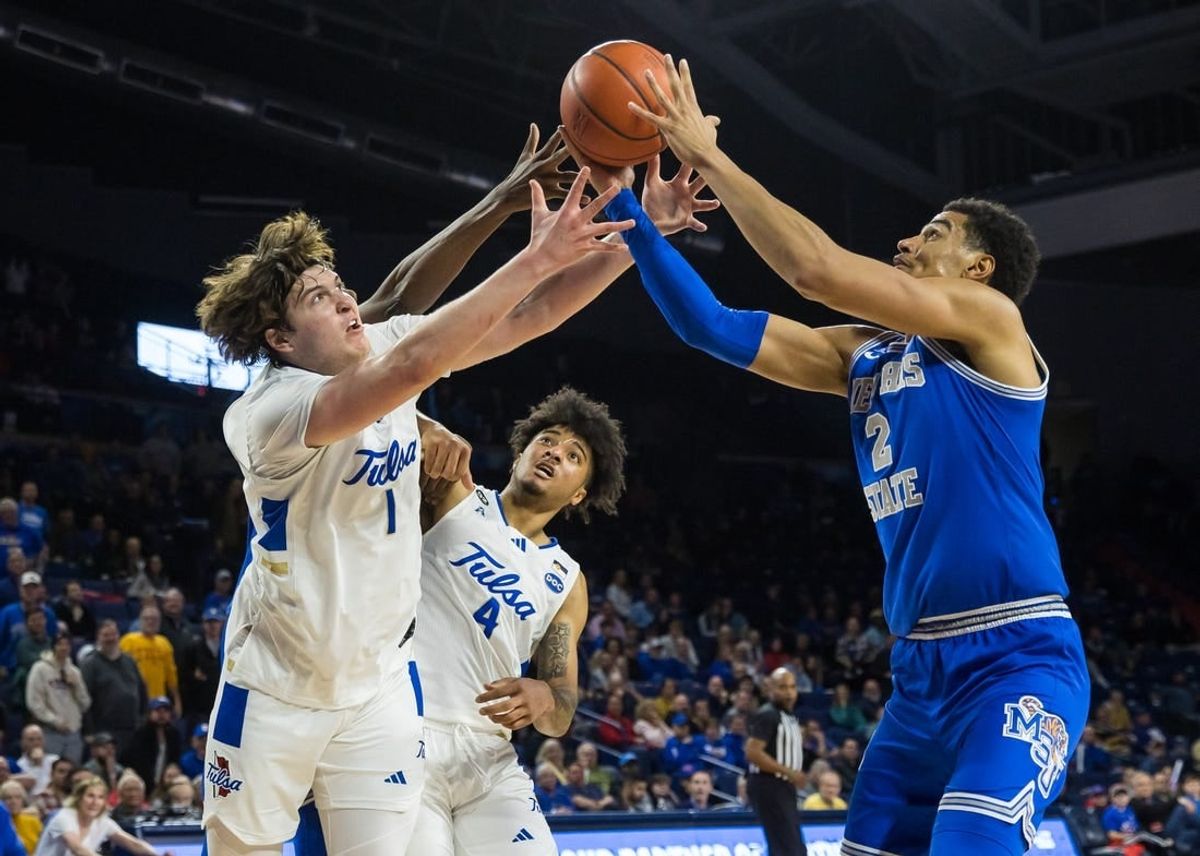 Jan 4, 2024; Tulsa, Oklahoma, USA; Tulsa Golden Hurricane forward Matt Reed (1) and guard PJ Haggerty (4) go for a loose ball against Memphis Tigers forward Nick Jourdain (2) during the second half at the Reynolds Center. The Memphis Tigers won the game 78-75.