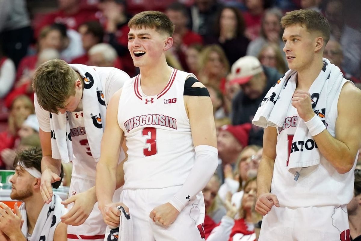 Jan 26, 2024; Madison, Wisconsin, USA; Wisconsin Badgers guard Connor Essegian (3) celebrates a basket during the second half against the Michigan State Spartans at the Kohl Center.