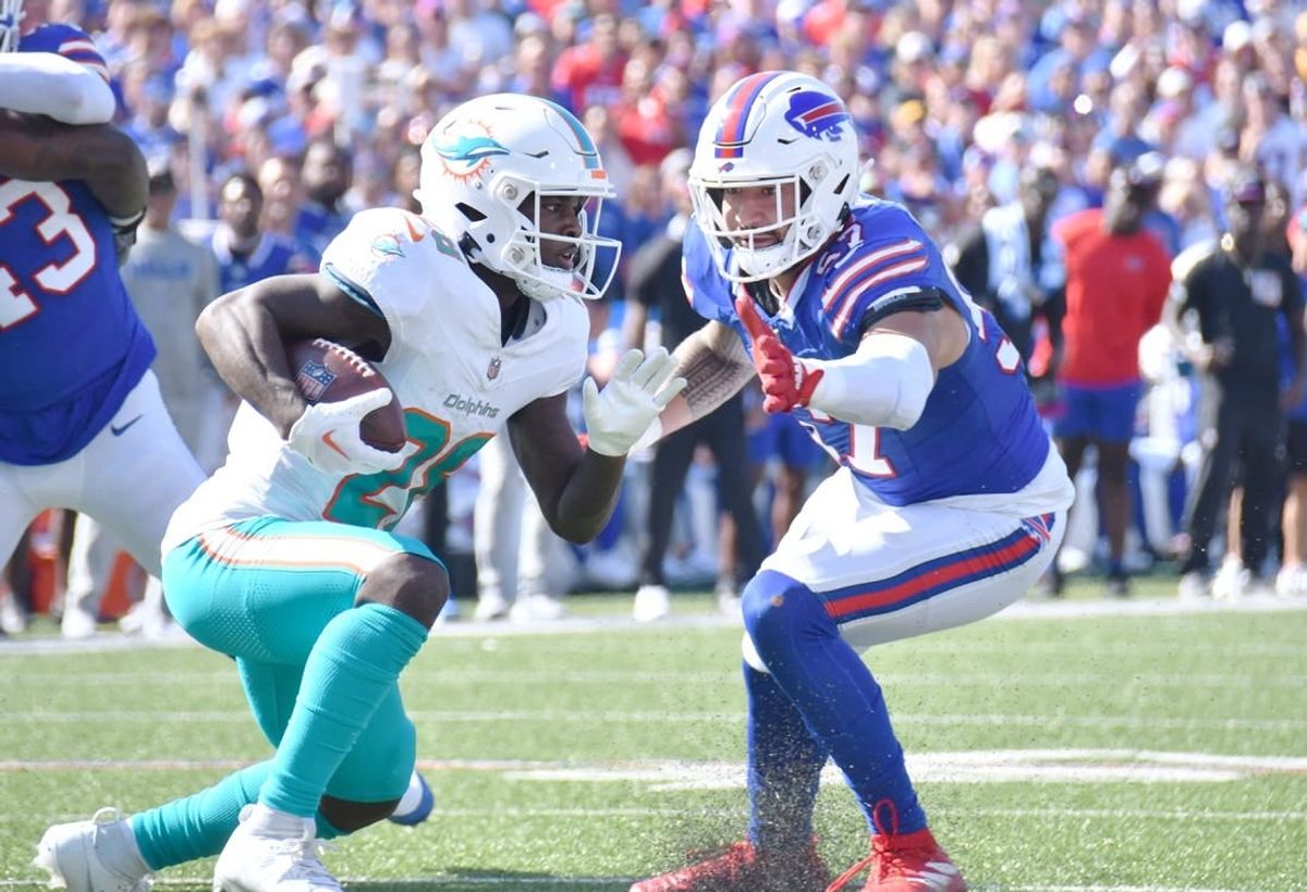 Oct 1, 2023; Orchard Park, New York, USA; Buffalo Bills cornerback Christian Benford (47) tries to tackle Miami Dolphins running back De'Von Achane (28) in the second quarter at Highmark Stadium.