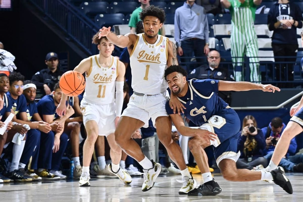 Feb 14, 2024; South Bend, Indiana, USA; Georgia Tech Yellow Jackets guard Kyle Sturdivant (1) knocks the ball away from Notre Dame Fighting Irish guard Julian Roper II (1) in the first half at the Purcell Pavilion.