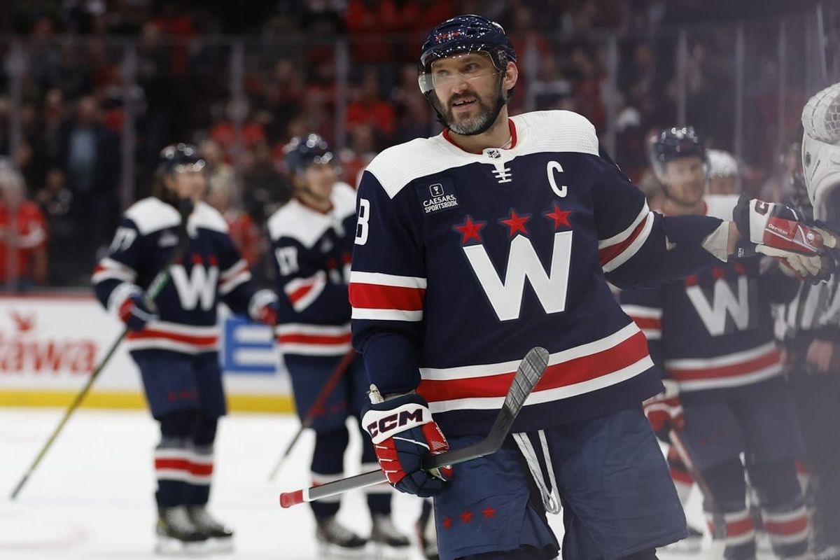 Feb 20, 2024; Washington, District of Columbia, USA; Washington Capitals left wing Alex Ovechkin (8) celebrates with teammates after scoring a goal against the New Jersey Devils in the third period at Capital One Arena.