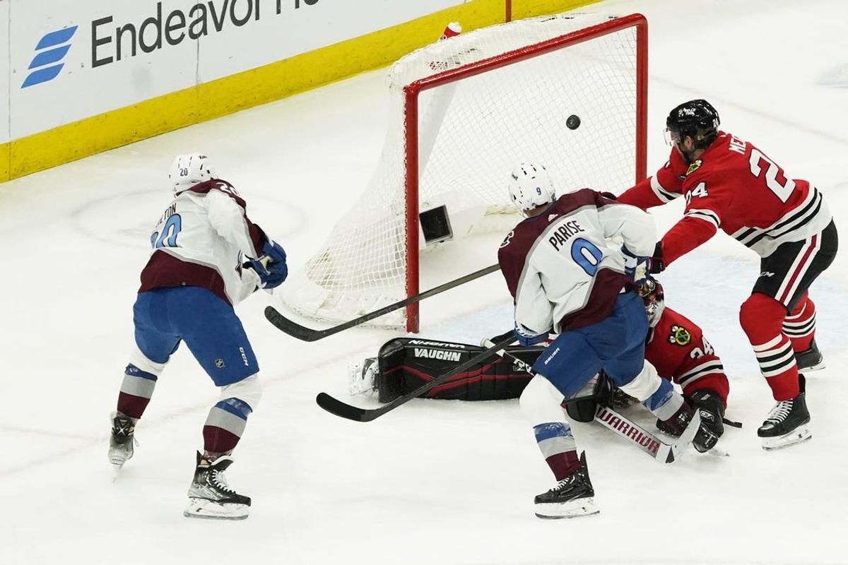Feb 29, 2024; Chicago, Illinois, USA; Colorado Avalanche center Ross Colton (20) scores a goal on Chicago Blackhawks goaltender Petr Mrazek (34) during the second period at United Center.