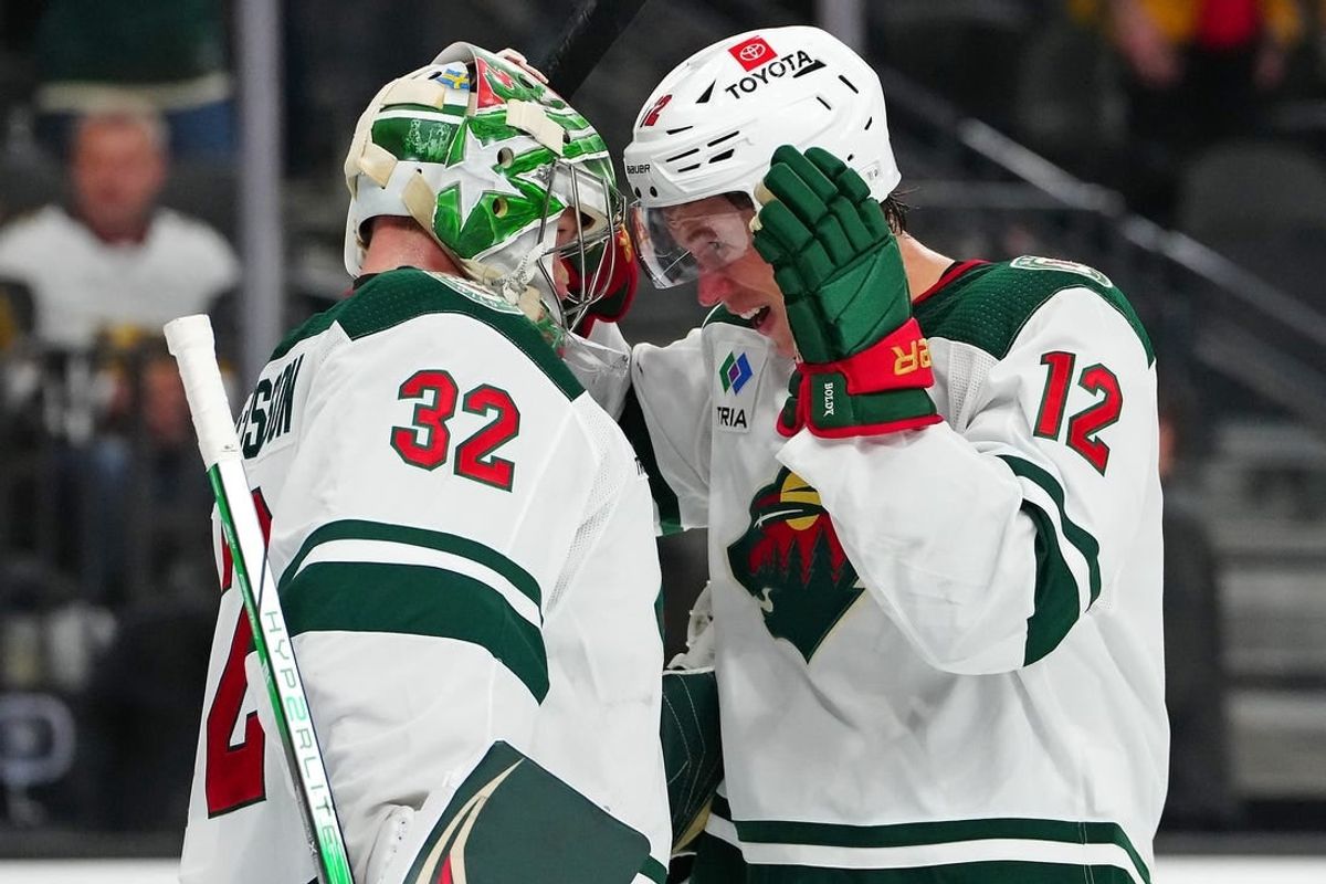 Feb 12, 2024; Las Vegas, Nevada, USA; Minnesota Wild left wing Matt Boldy (12) congratulates Minnesota Wild goaltender Filip Gustavsson (32) after the Wild defeated the Vegas Golden Knights 5-3 at T-Mobile Arena.