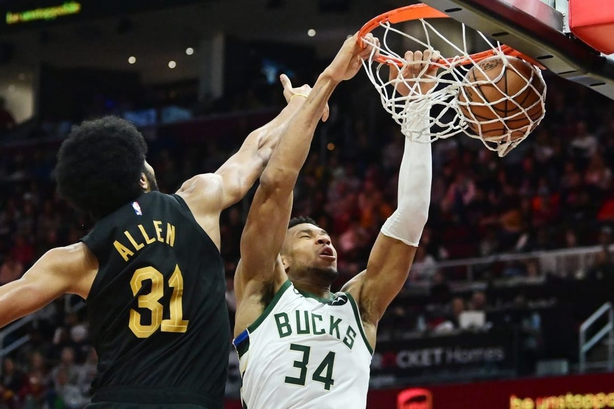 Dec 29, 2023; Cleveland, Ohio, USA; Milwaukee Bucks forward Giannis Antetokounmpo (34) dunks as Cleveland Cavaliers center Jarrett Allen (31) defends during the second half at Rocket Mortgage FieldHouse.