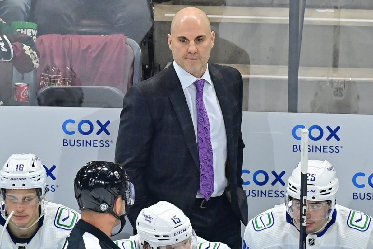 Apr 13, 2023; Tempe, Arizona, USA;  Vancouver Canuck head coach Rick Tocchet watches game action in the first period against the Arizona Coyotes at Mullett Arena.