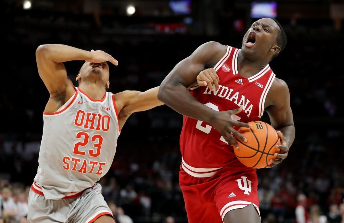 Feb 6, 2024; Columbus, Ohio, USA; Indiana Hoosiers forward Payton Sparks (24) controls the ball as Ohio State Buckeyes forward Zed Key (23) defends during the first half at Value City Arena.