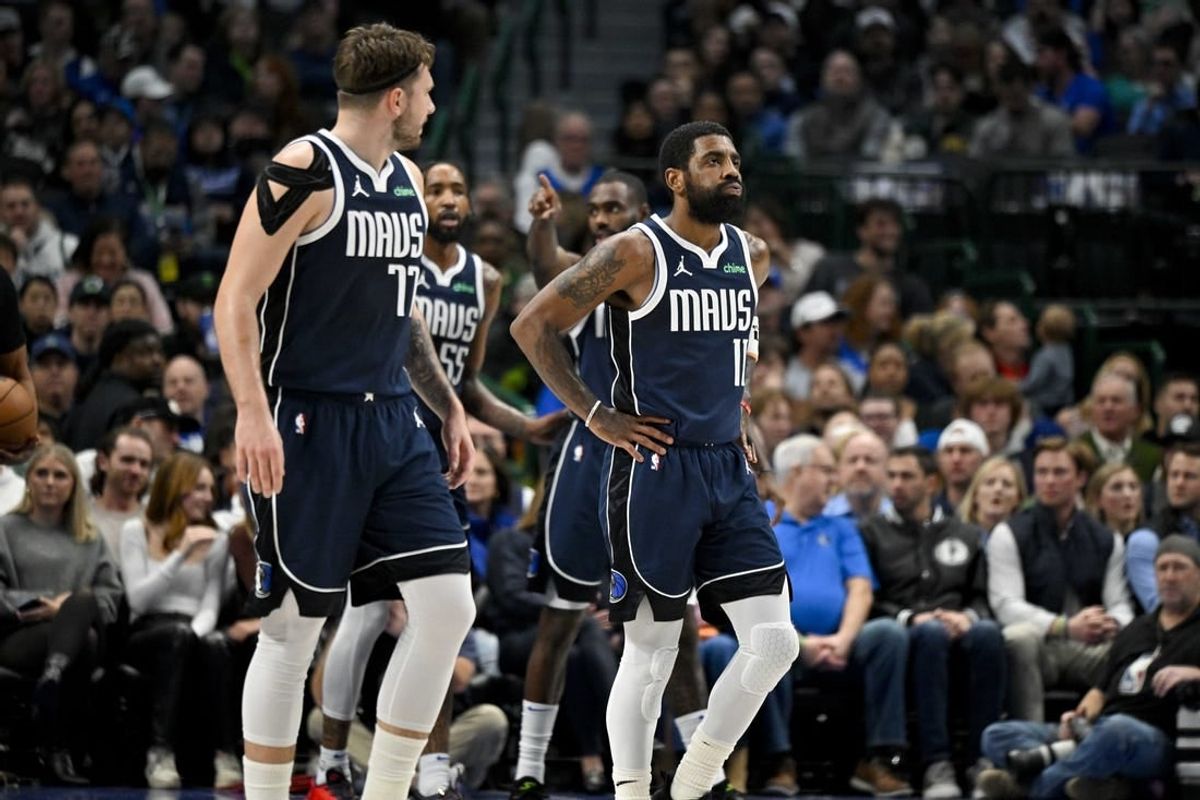 Jan 3, 2024; Dallas, Texas, USA; Dallas Mavericks guard Luka Doncic (77) and guard Kyrie Irving (11) walk back up the court during the first quarter against the Portland Trail Blazers at the American Airlines Center.