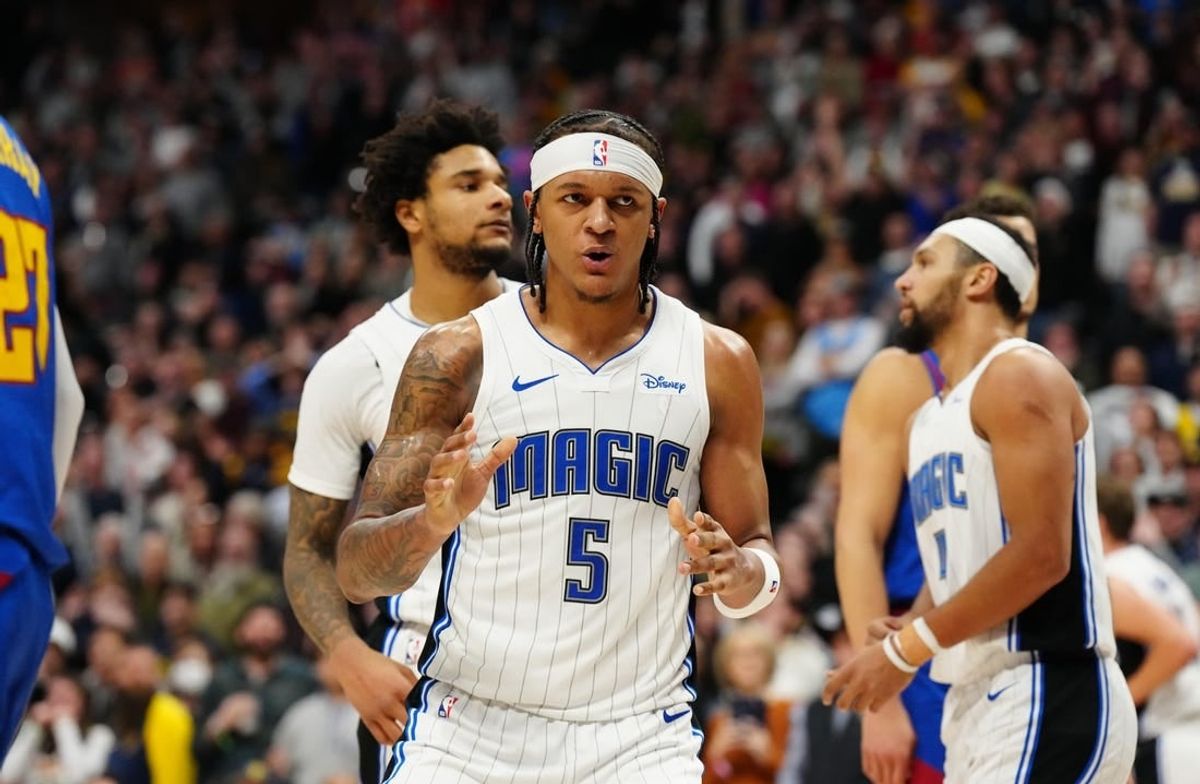 Jan 5, 2024; Denver, Colorado, USA; Orlando Magic forward Paolo Banchero (5) reacts in the fourth quarter against the Denver Nuggets at Ball Arena.