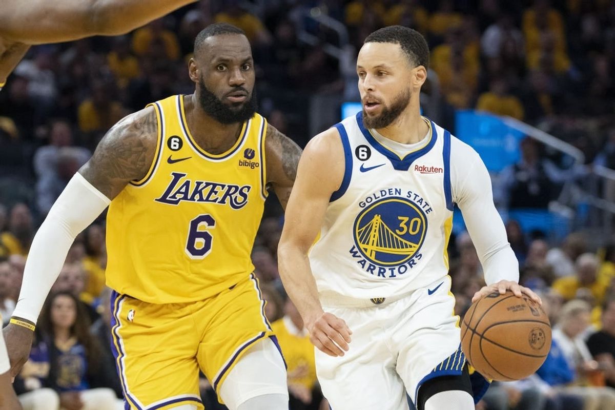 May 10, 2023; San Francisco, California, USA; Golden State Warriors guard Stephen Curry (30) dribbles the basketball against Los Angeles Lakers forward LeBron James (6) during the fourth quarter in game five of the 2023 NBA playoffs conference semifinals round at Chase Center.