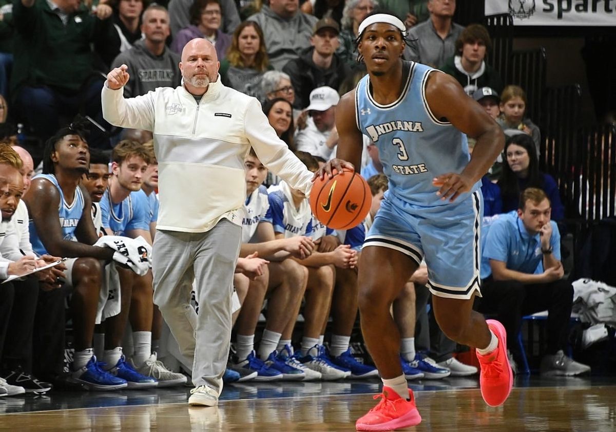 Dec 30, 2023; East Lansing, Michigan, USA; Indiana State Sycamores head coach Josh Schertz shouts directions to his offense including Indiana State Sycamores guard Ryan Conwell (3), during the first half against the Michigan State Spartans at Jack Breslin Student Events Center.