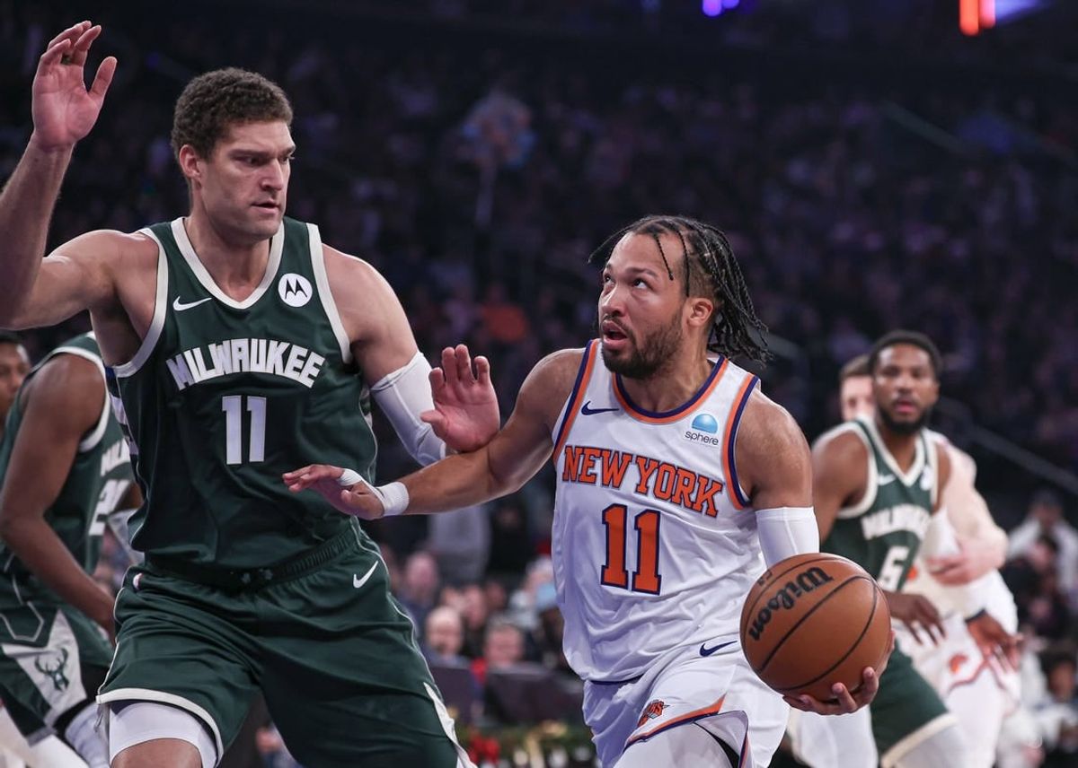 Dec 25, 2023; New York, New York, USA; New York Knicks guard Jalen Brunson (11) drives to the basket against Milwaukee Bucks center Brook Lopez (11) during the first quarter at Madison Square Garden.