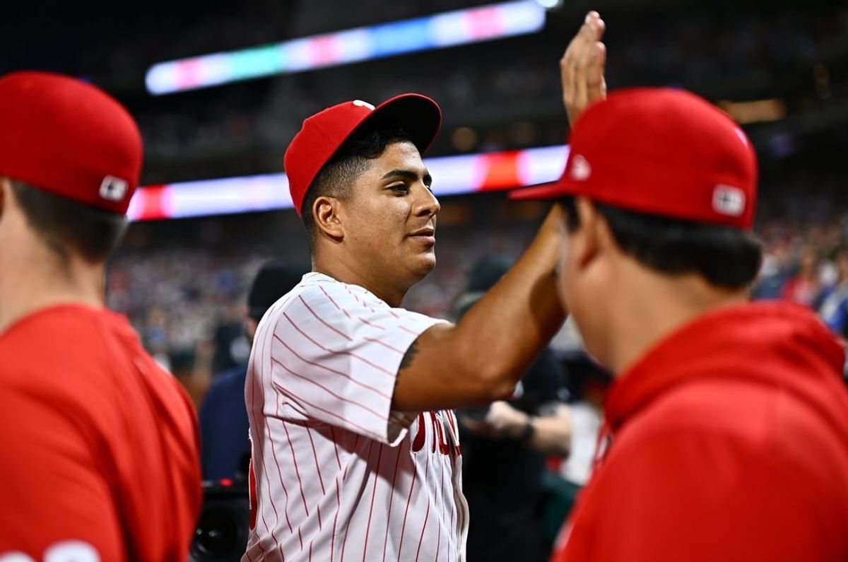 Apr 16, 2024; Philadelphia, Pennsylvania, USA; Philadelphia Phillies starting pitcher Ranger Suarez (55) celebrates with teammates after pitching a complete game shutout against the Colorado Rockies at Citizens Bank Park.