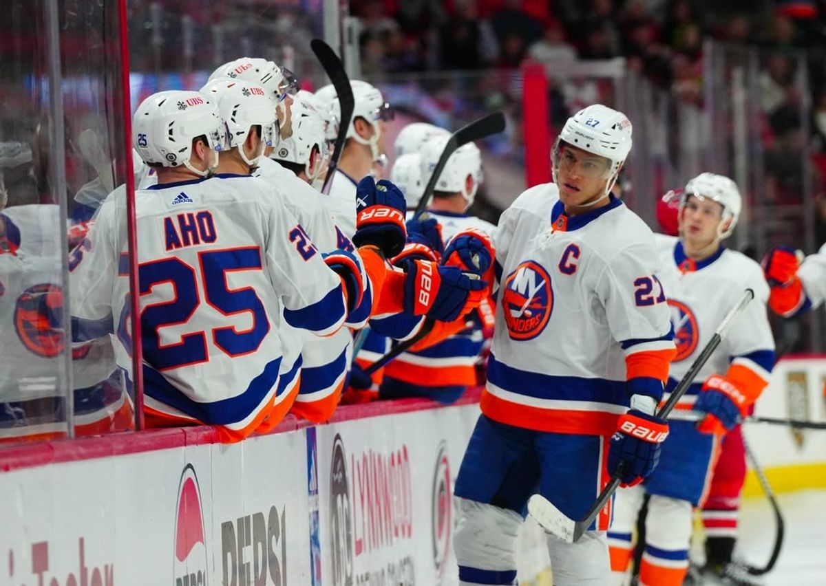 Dec 23, 2023; Raleigh, North Carolina, USA; New York Islanders left wing Anders Lee (27) celebrates his goal against the Carolina Hurricanes during the third period at PNC Arena.