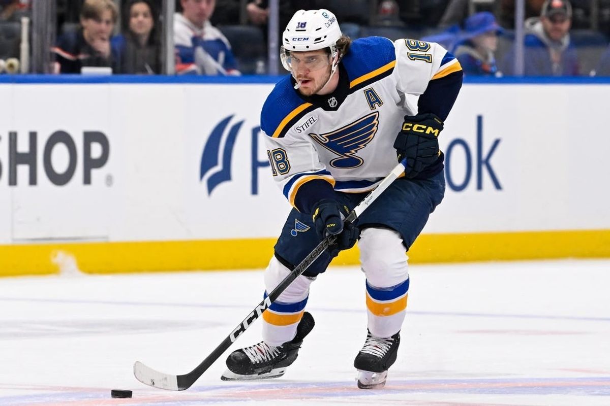Mar 5, 2024; Elmont, New York, USA; St. Louis Blues center Robert Thomas (18) skates with puck against the New York Islanders during the first period at UBS Arena.