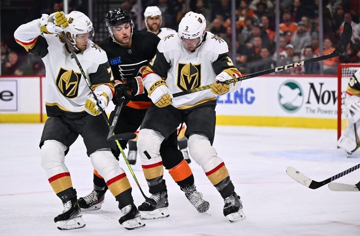 Nov 18, 2023; Philadelphia, Pennsylvania, USA; Vegas Golden Knights defenseman Brayden McNabb (3) and center William Karlsson (71) battle for the puck with Philadelphia Flyers right wing Tyson Foerster (71) in the second period at Wells Fargo Center.