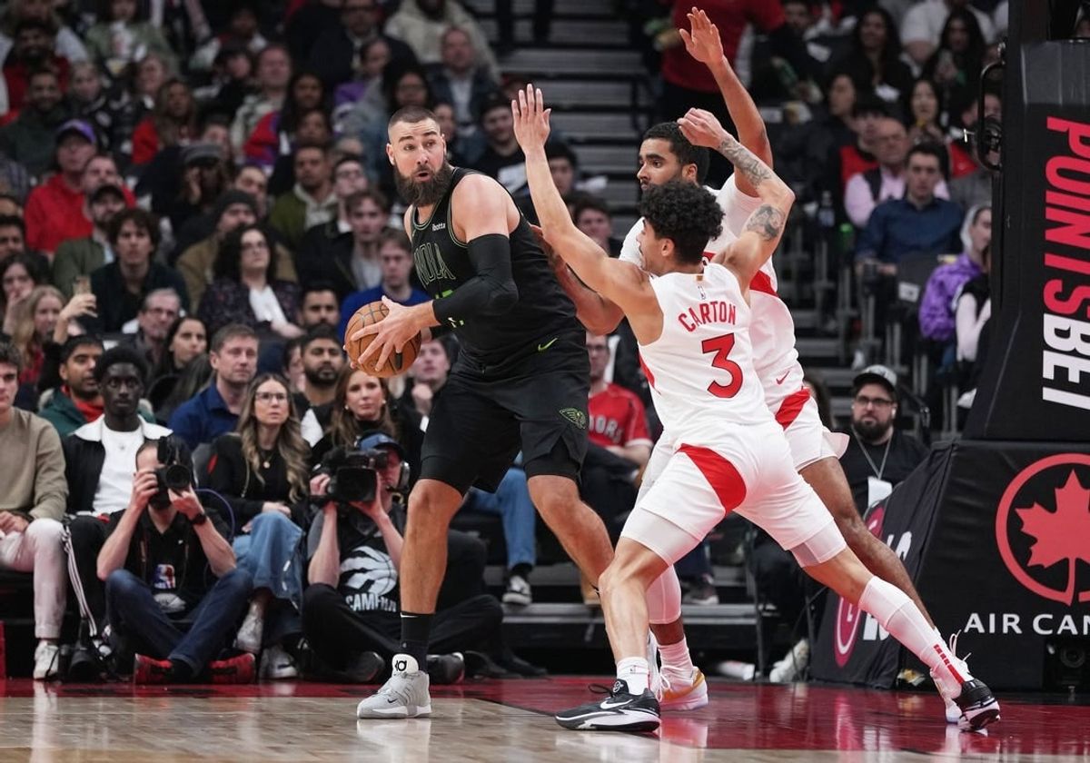 Mar 5, 2024; Toronto, Ontario, CAN; New Orleans Pelicans center Jonas Valanciunas (17) controls the ball as Toronto Raptors guard D.J. Carton (3) tries to defend during the second quarter at Scotiabank Arena.