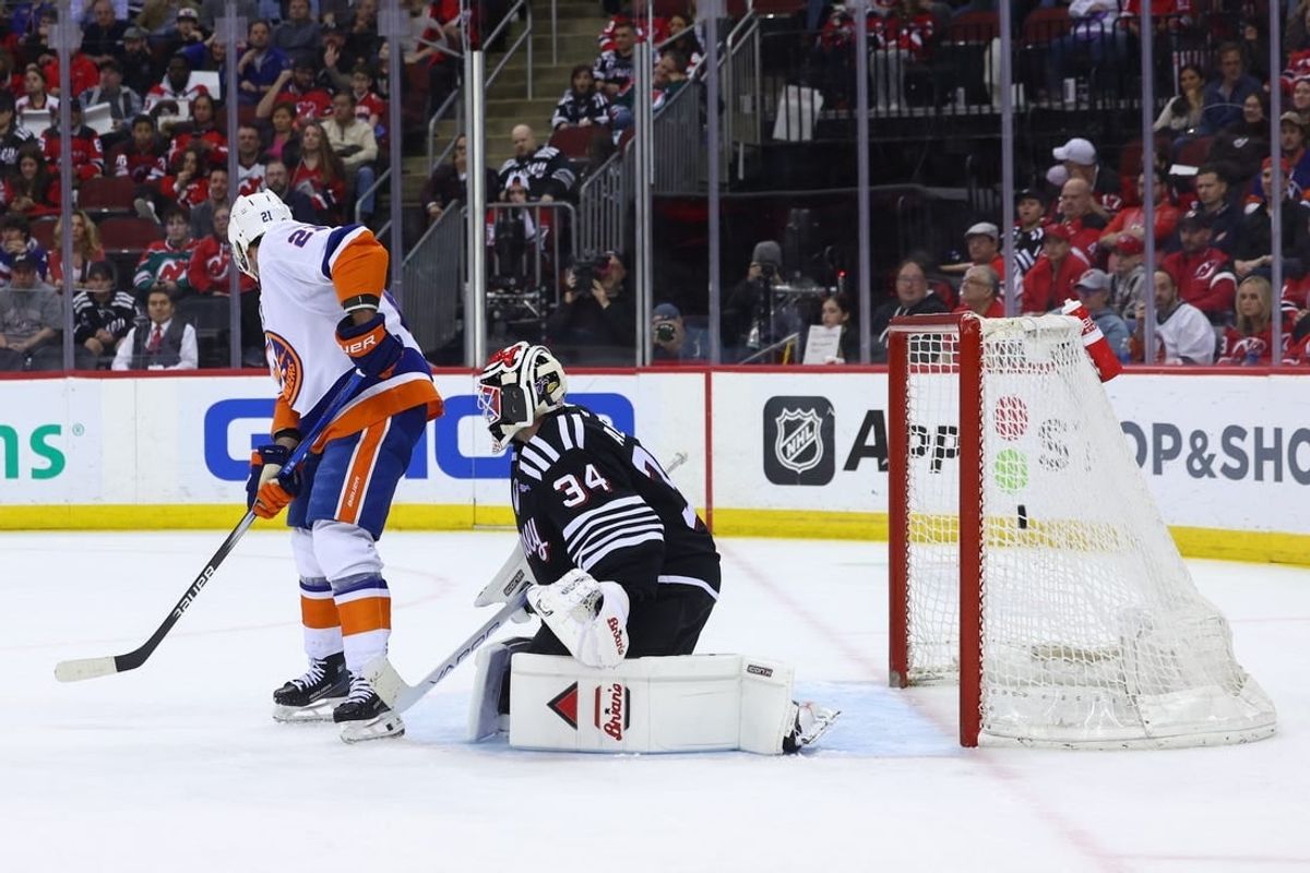Apr 15, 2024; Newark, New Jersey, USA; New York Islanders center Kyle Palmieri (21) scores a goal on New Jersey Devils goaltender Jake Allen (34) during the first period at Prudential Center.