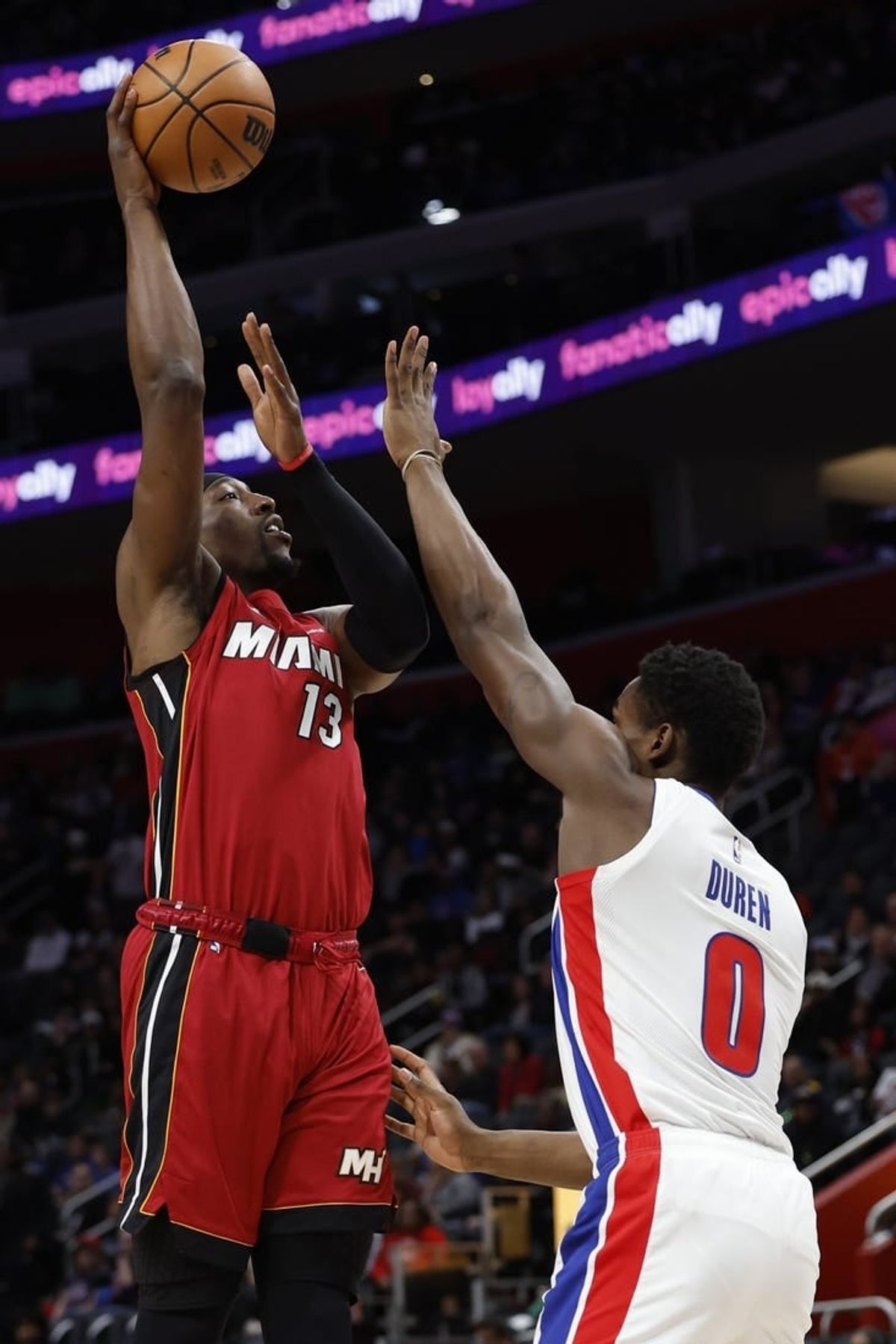 Mar 17, 2024; Detroit, Michigan, USA;  Miami Heat center Bam Adebayo (13) shoots on Detroit Pistons center Jalen Duren (0) in the first half at Little Caesars Arena.