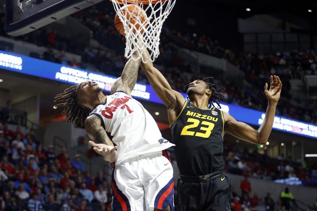 Feb 17, 2024; Oxford, Mississippi, USA; Mississippi Rebels guard Allen Flanigan (7) and Missouri Tigers forward Aidan Shaw (23) battle for a rebound during the first half at The Sandy and John Black Pavilion at Ole Miss.
