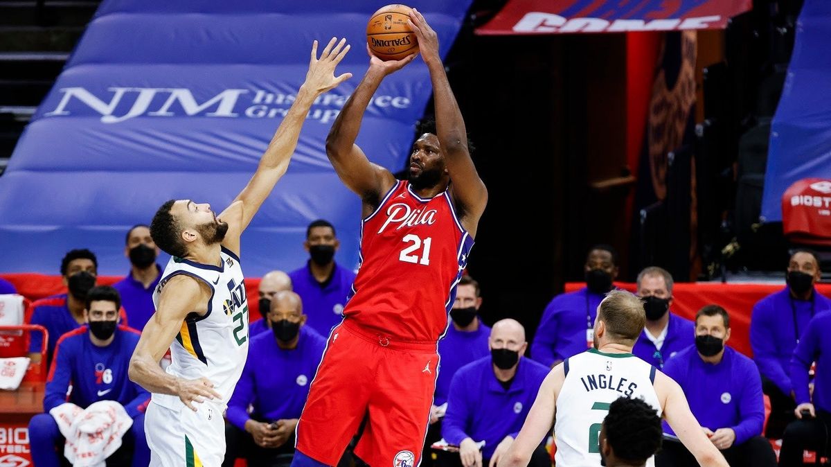 Rudy Gobert tries, and fails, to stop Joel Embiid from getting a shot off.