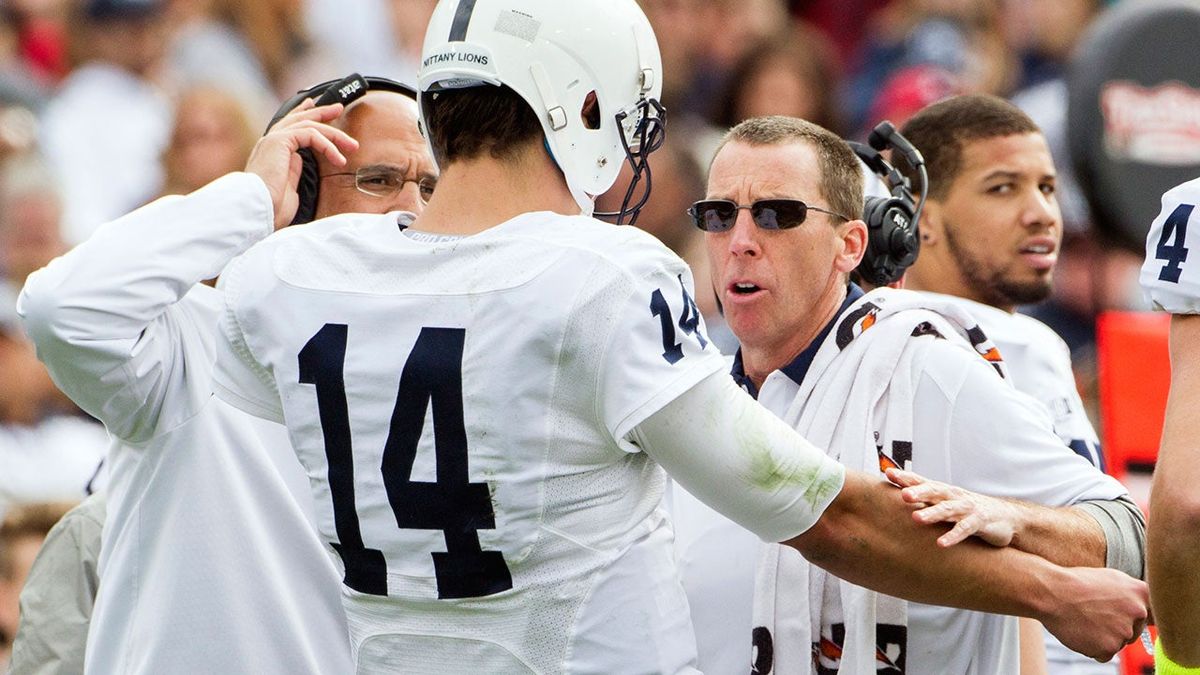 Tim Bream (in sunglasses) checks on Christian Hackenberg during a bowl game last year. Photo: Mark Wallheiser/ [object Object]