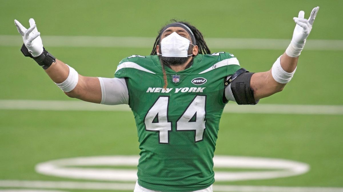 Jets’  linebacker Harvey Langi celebrates . . .  something.