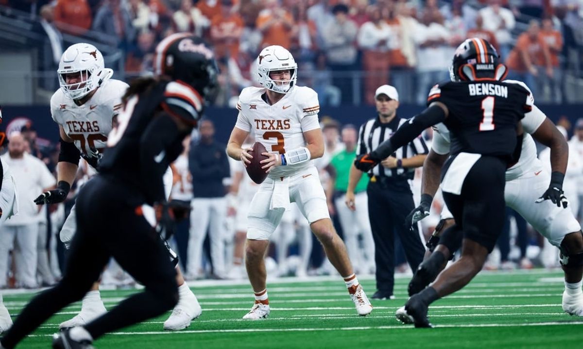 Dec 2, 2023; Arlington, TX, USA;  Texas Longhorns quarterback Quinn Ewers (3) looks to throw during the first quarter against the Oklahoma State Cowboys at AT&T Stadium.