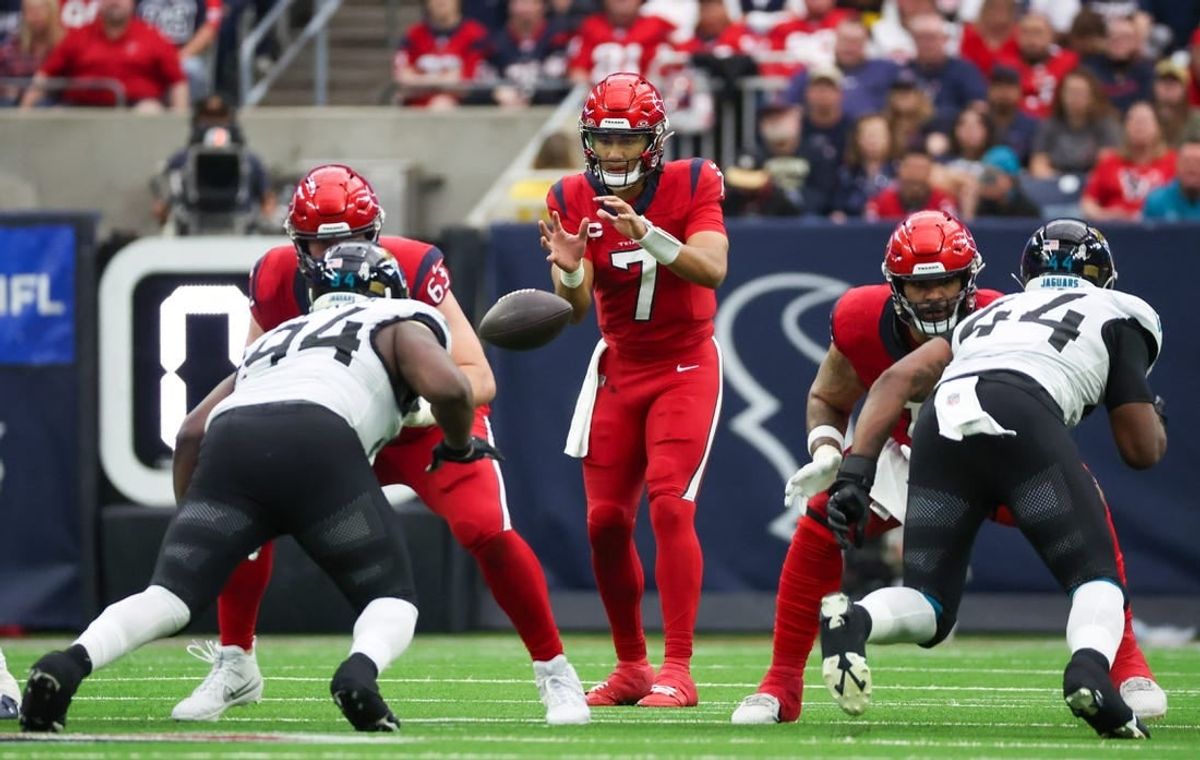 Nov 26, 2023; Houston, Texas, USA;  The ball is hiked to Houston Texans quarterback C.J. Stroud (7) against the Jacksonville Jaguars at NRG Stadium.