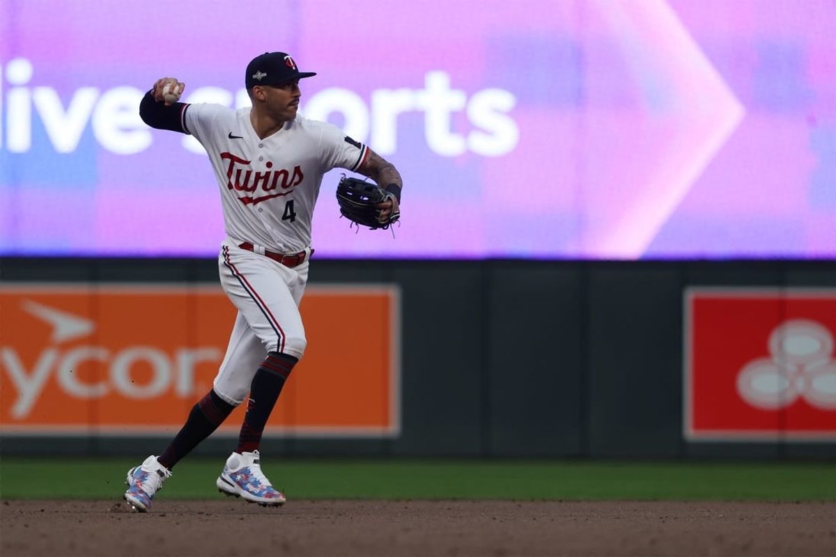 Oct 4, 2023; Minneapolis, Minnesota, USA; Minnesota Twins shortstop Carlos Correa (4) throws to first for an out in the eighth inning against the Toronto Blue Jays during game two of the Wildcard series for the 2023 MLB playoffs at Target Field.