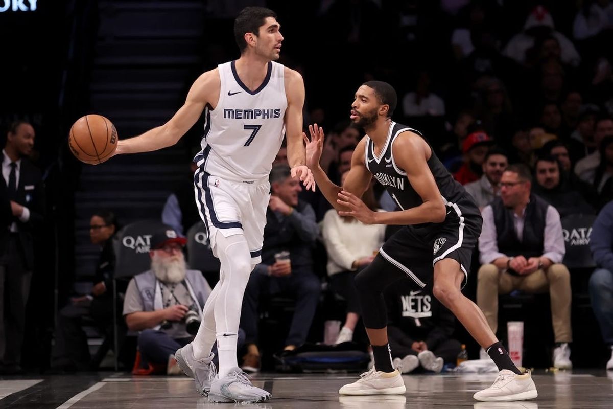 Mar 4, 2024; Brooklyn, New York, USA; Memphis Grizzlies forward Santi Aldama (7) controls the ball against Brooklyn Nets forward Mikal Bridges (1) during the first quarter at Barclays Center.