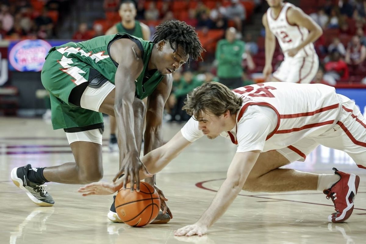 Nov 10, 2023; Norman, Oklahoma, USA;Mississippi Valley State Delta Devils forward Quoiren Waldon (20) and Oklahoma Sooners forward Luke Northweather (45) fight for a loose ball during the first half at Lloyd Noble Center.