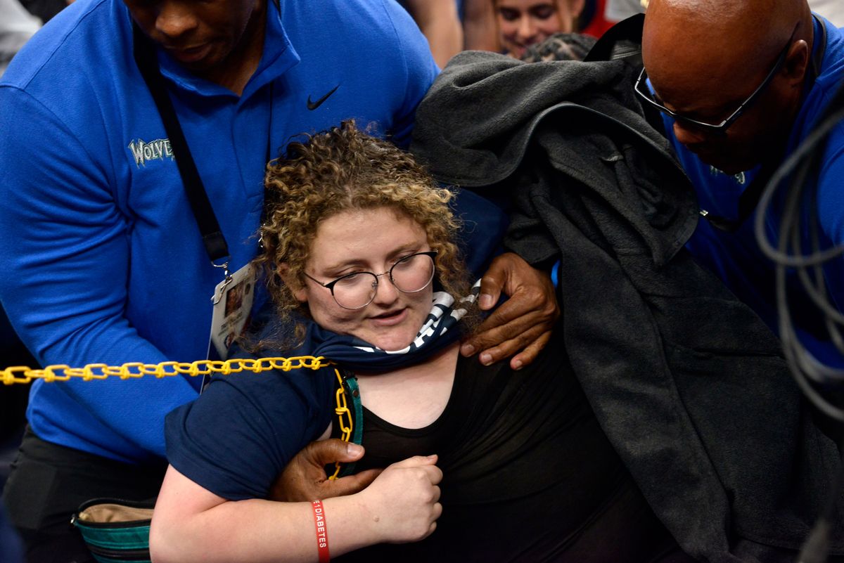 Animal rights activist Zoe Rosenberg is removed from the court in Minneapolis.