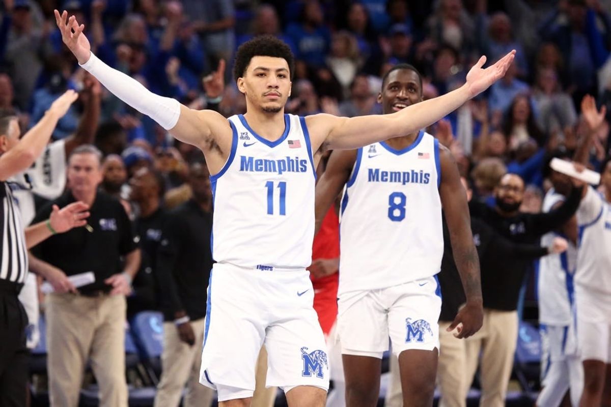 Jan 7, 2024; Memphis, Tennessee, USA; Memphis Tigers guard Jahvon Quinerly (11) reacts after making a three point shot with 3.2 seconds left during the second half against the Southern Methodist Mustangs at FedExForum.