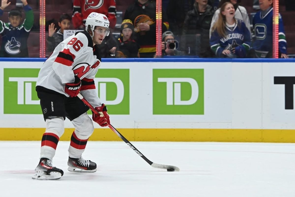 Dec 5, 2023; Vancouver, British Columbia, CAN; New Jersey Devils center Jack Hughes (86) controls the puck during the pregame warmup against the Vancouver Canucks at Rogers Arena.