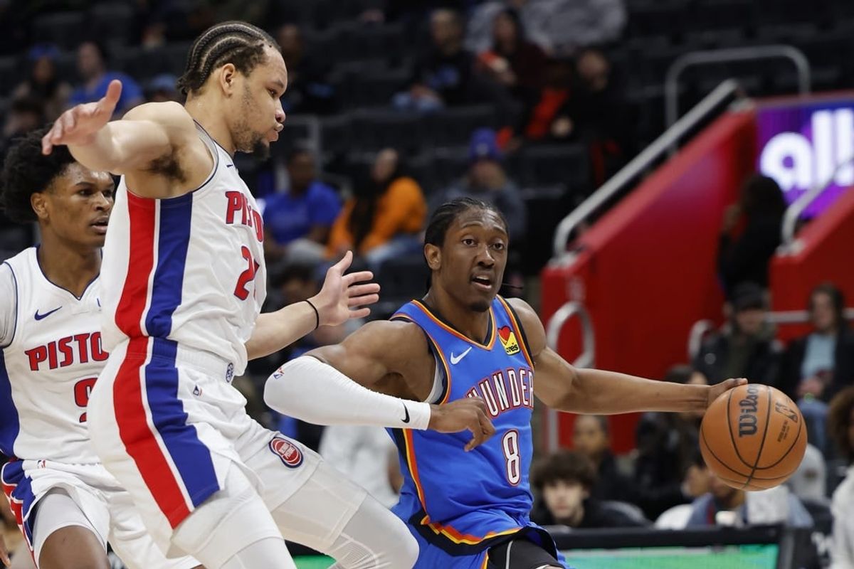 Jan 28, 2024; Detroit, Michigan, USA; Oklahoma City Thunder forward Jalen Williams (8) dribbles on Detroit Pistons forward Kevin Knox II (24) in the first half at Little Caesars Arena.