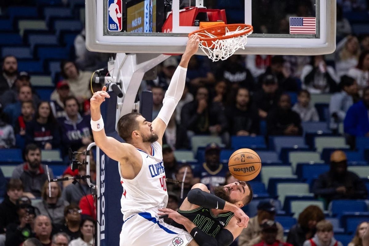 Jan 5, 2024; New Orleans, Louisiana, USA;  LA Clippers center Ivica Zubac (40) dunks the ball against New Orleans Pelicans center Jonas Valanciunas (17) during the first half at Smoothie King Center.