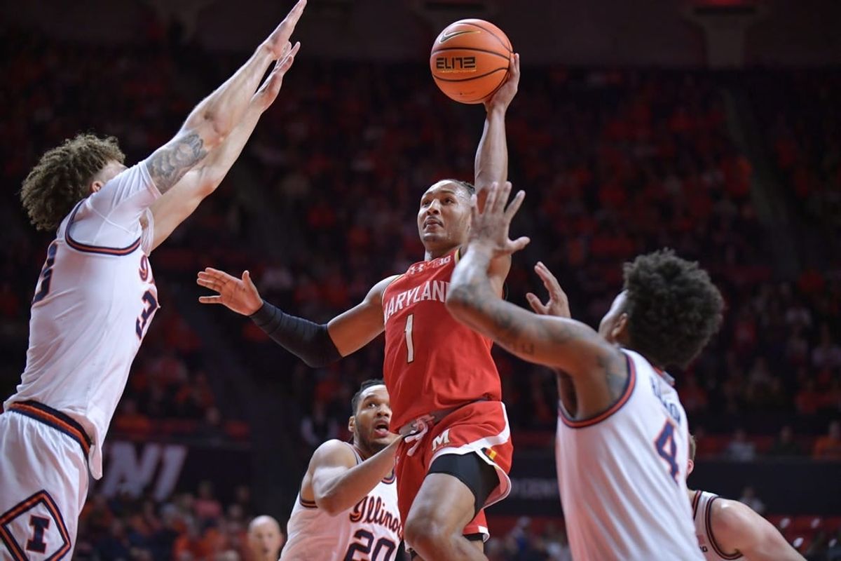 Jan 14, 2024; Champaign, Illinois, USA;  Maryland Terrapins guard Jahmir Young (1) shoots the ball over Illinois Fighting Illini forward Coleman Hawkins (33) on a drive to the basket  during the second half at State Farm Center.