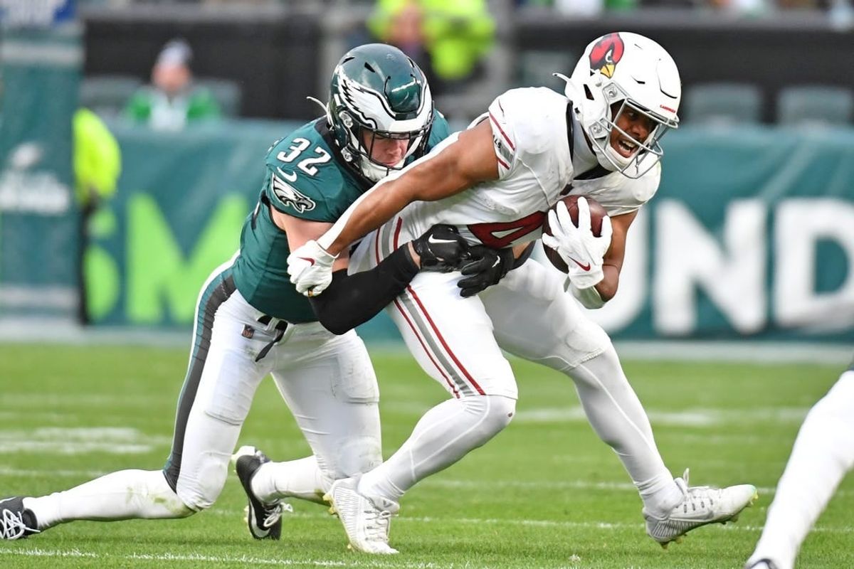 Dec 31, 2023; Philadelphia, Pennsylvania, USA; Arizona Cardinals wide receiver Rondale Moore (4) is tackled by Philadelphia Eagles safety Reed Blankenship (32) during the fourth quarter at Lincoln Financial Field.