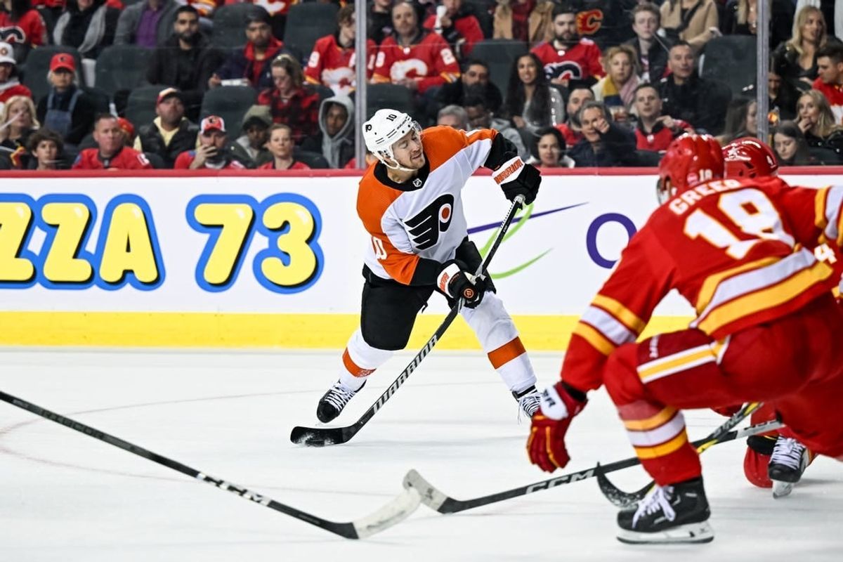 Dec 31, 2023; Calgary, Alberta, CAN; Philadelphia Flyers right wing Bobby Brink (10) takes a shot against the Calgary Flames during the second period at Scotiabank Saddledome.