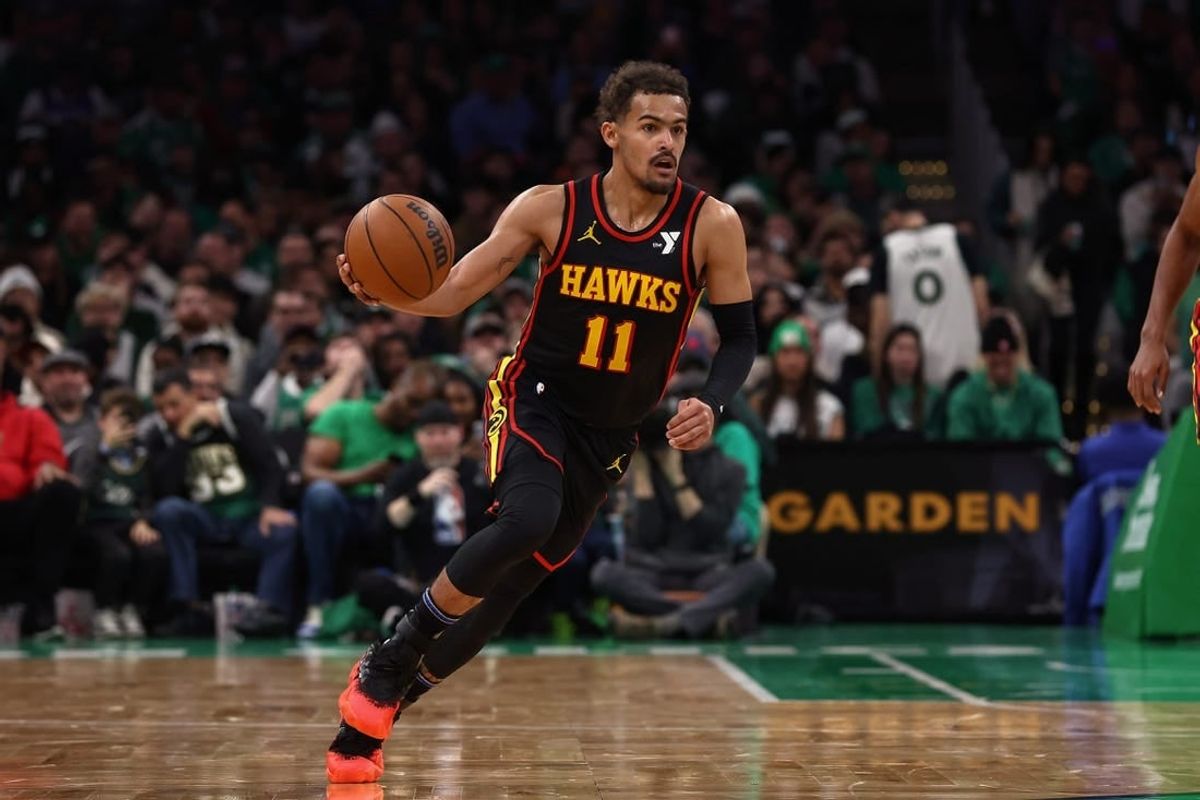 Nov 26, 2023; Boston, Massachusetts, USA; Atlanta Hawks guard Trae Young (11) brings the ball up the court against the Boston Celtics during the second quarter at TD Garden.
