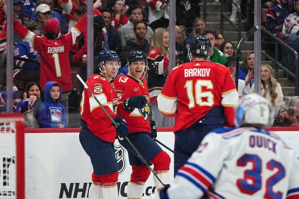 Dec 29, 2023; Sunrise, Florida, USA; Florida Panthers center Sam Reinhart (13) celebrates his goal on New York Rangers goaltender Jonathan Quick (32) with center Carter Verhaeghe (23) and center Aleksander Barkov (16) during the second period at Amerant Bank Arena.