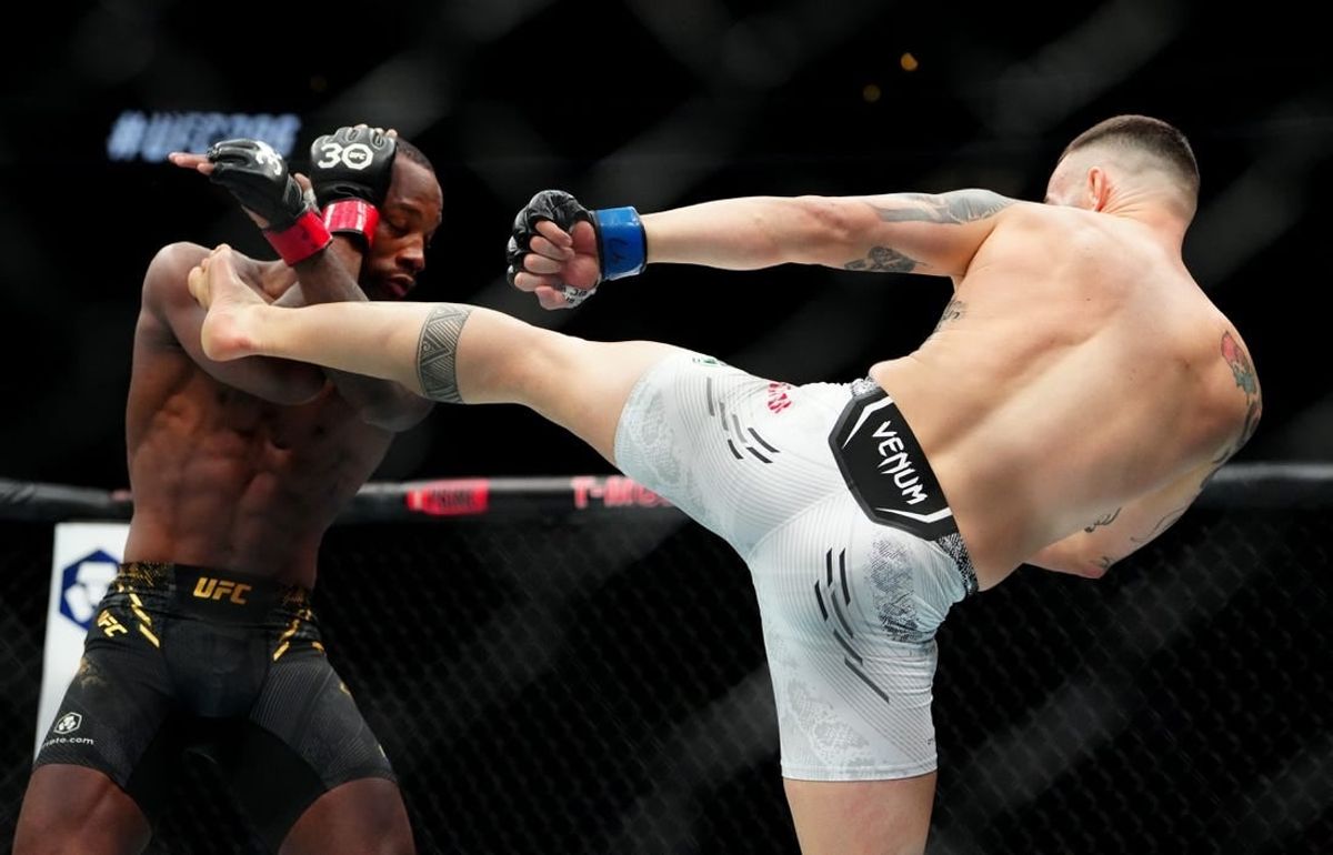 Dec 16, 2023; Las Vegas, Nevada, USA; Leon Edwards (red gloves) fights Colby Covington (blue gloves) during UFC 296 at T-Mobile Arena.
